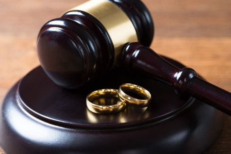 Gavel and wedding rings