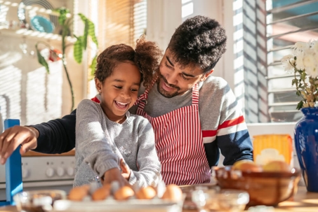 Dad cooking with daughter